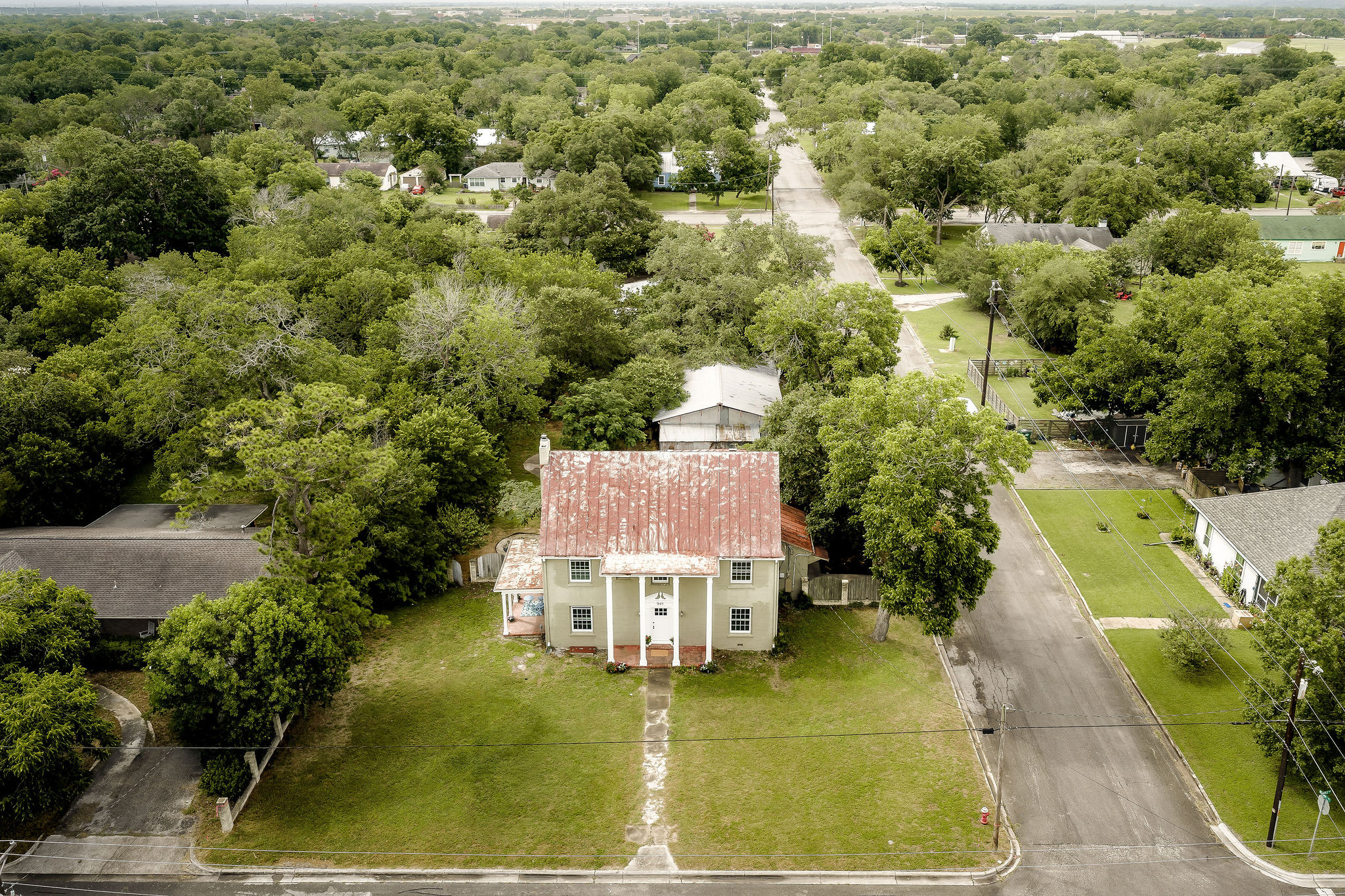 948 Maple Street Lockhart, TX 78644 - Photo 35 of 40 Built in 1932 and situated on a rare half-acre corner lot near the town's historic core, this 4-bedroom, 2.5-bath home offers approximately 3,290 square feet of living space, remarkable architectural presence, and extraordinary potential for restoration and reimagination.