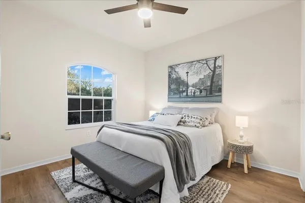 a bedroom with a bed and a window