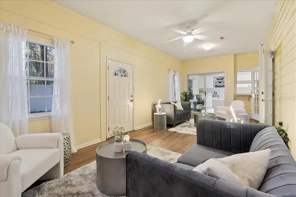 a living room with furniture and a large window