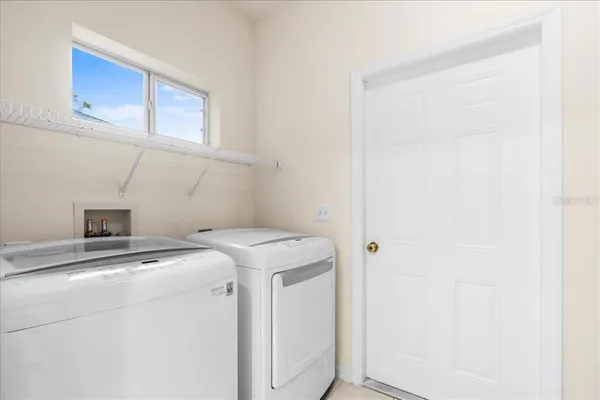 a utility room with dryer and washer
