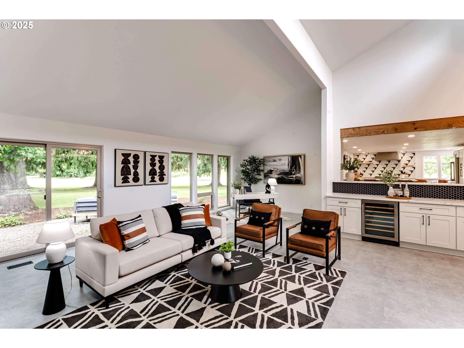 970 St Andrews Drive Eugene, OR 97401 - Photo 13 of 48 a living room with furniture a flat screen tv and a large window