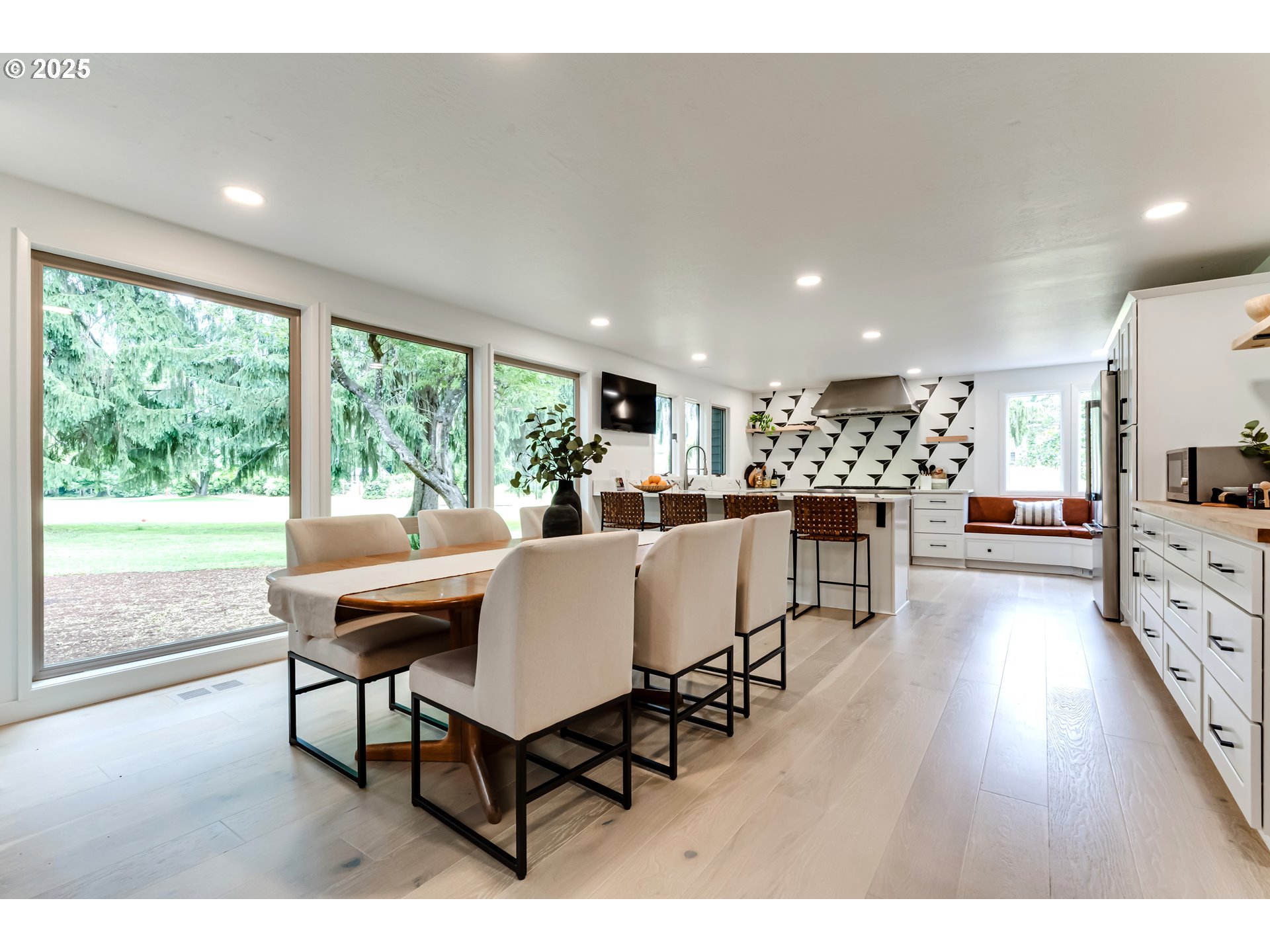 970 St Andrews Drive Eugene, OR 97401 - Photo 19 of 48 a living room with furniture a dining table and a large window