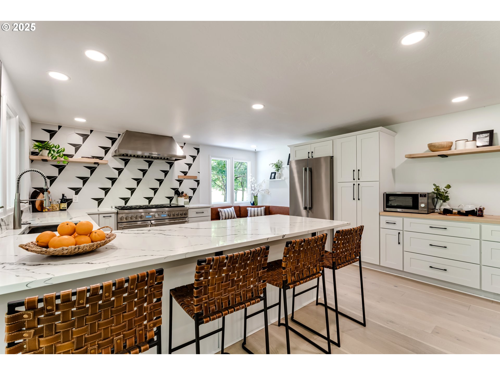 970 St Andrews Drive Eugene, OR 97401 - Photo 21 of 48 a kitchen with stainless steel appliances granite countertop a sink and cabinets