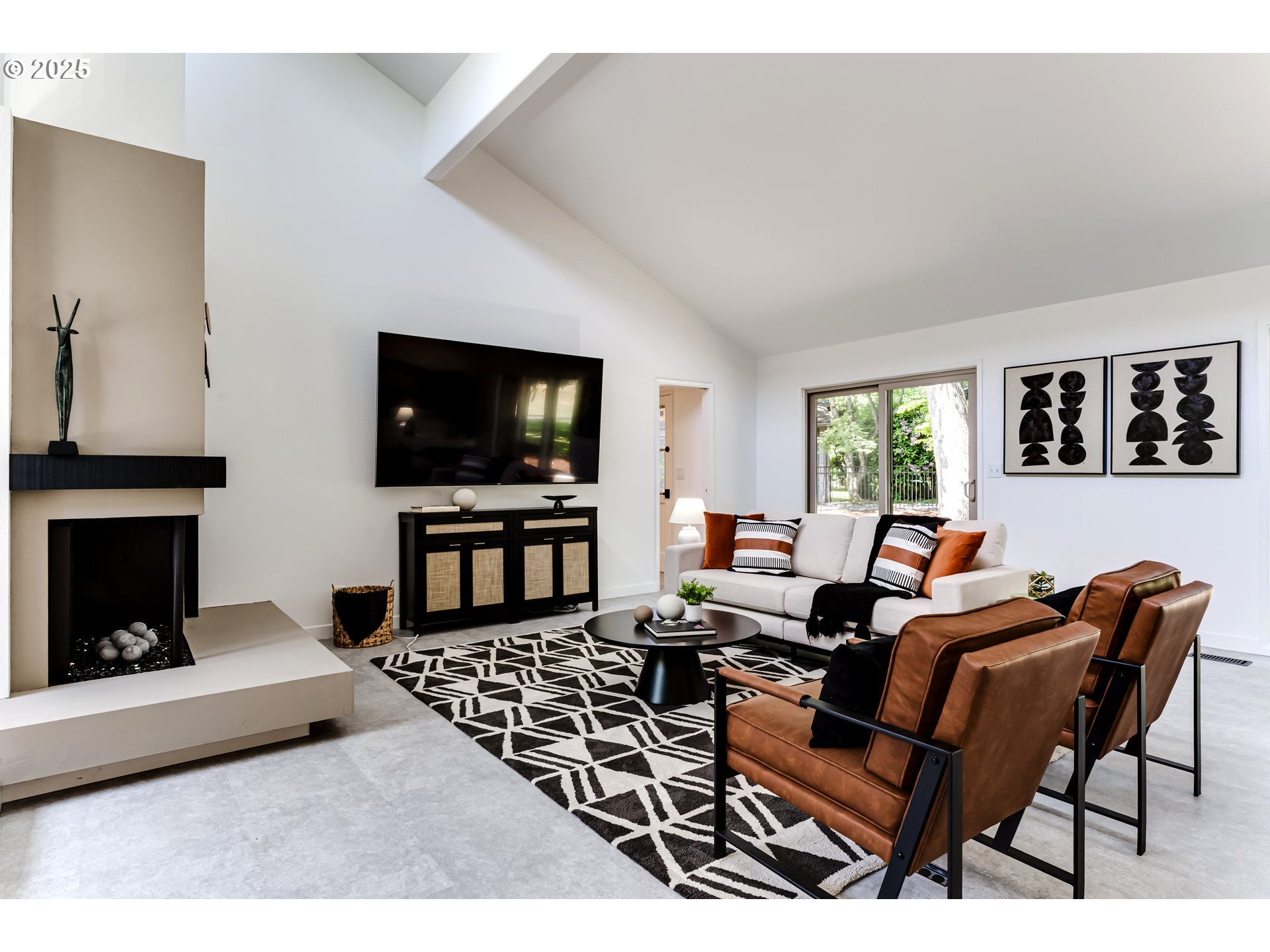 970 St Andrews Drive Eugene, OR 97401 - Photo 10 of 48 a living room with furniture a flat screen tv and a fireplace
