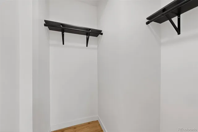 a view of a big room with a kitchen