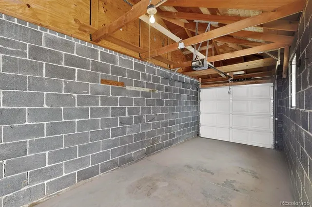 a view of a house with a yard and garage