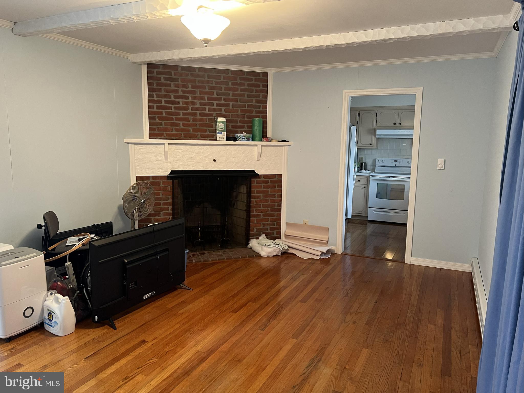 656 Snyder Avenue Beaver Springs, PA 17812 - Photo 3 of 39 a living room with furniture mirror and a fireplace