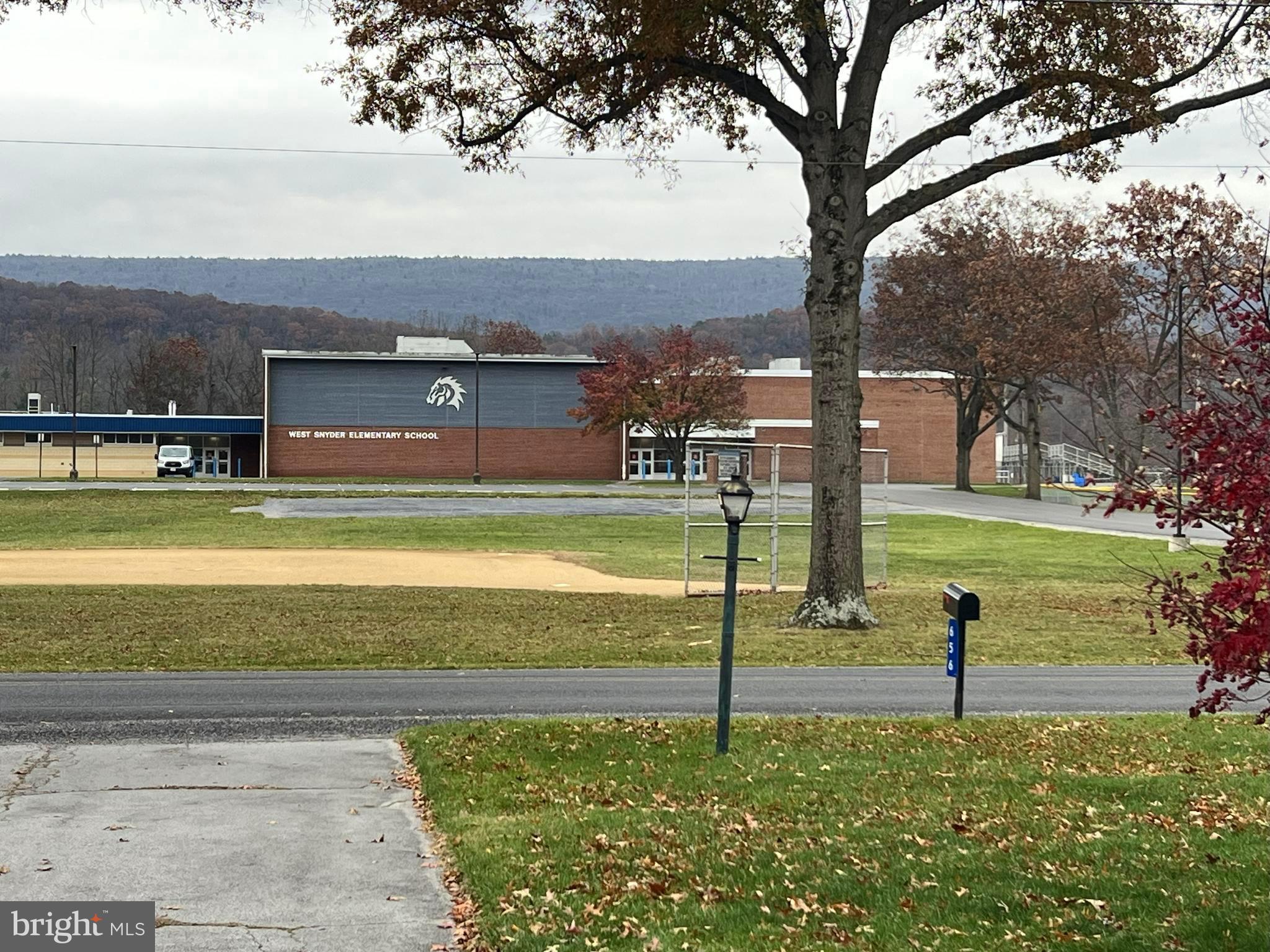 656 Snyder Avenue Beaver Springs, PA 17812 - Photo 39 of 39 a view of a fountain in front of a house