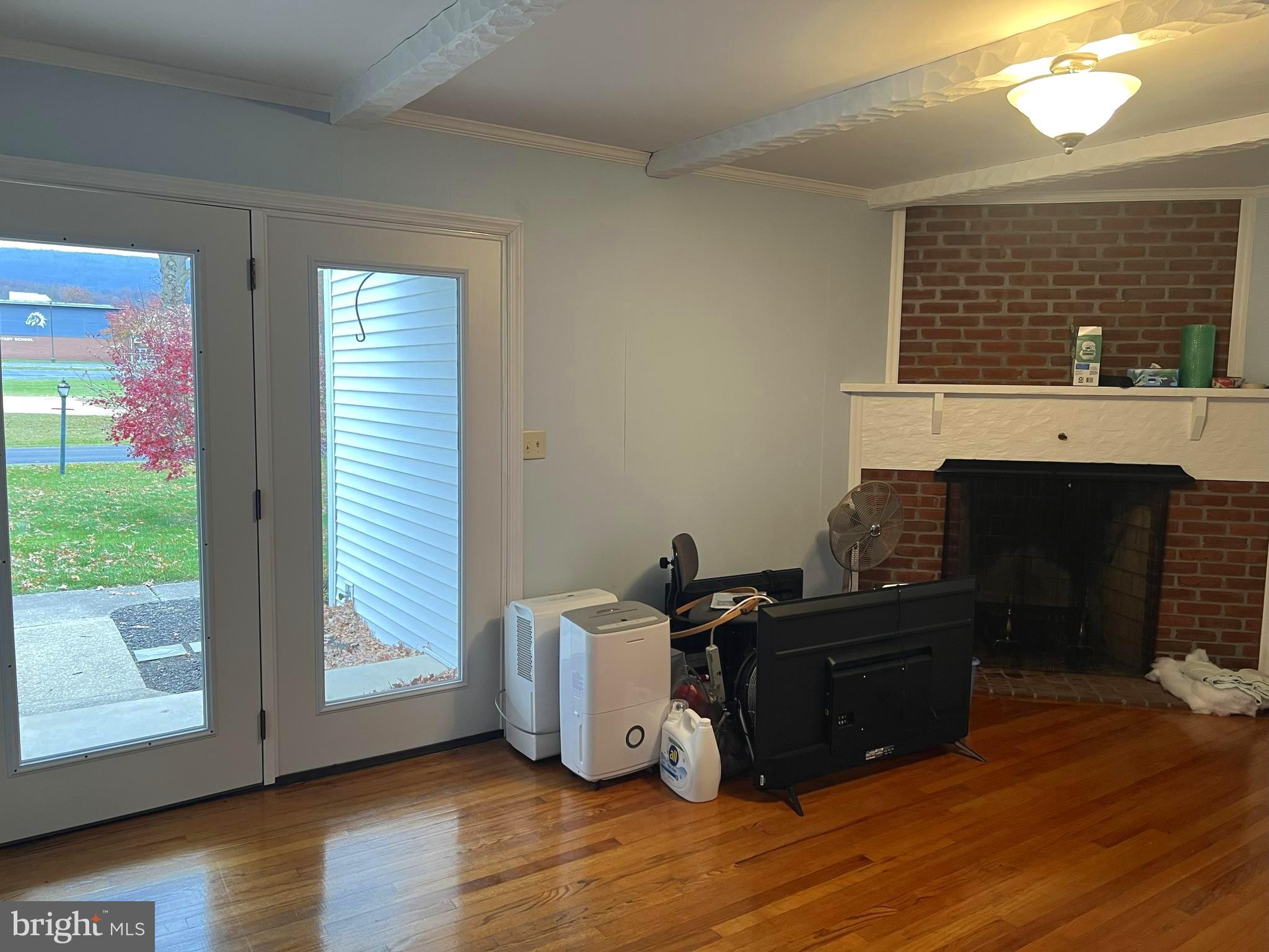 656 Snyder Avenue Beaver Springs, PA 17812 - Photo 4 of 39 a living room with furniture and a fireplace