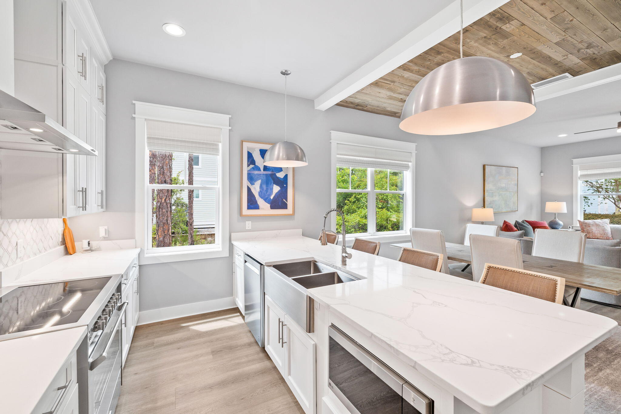 135 Redbud Ln Inlet Beach Inlet Beach, FL 32461 - Photo 18 of 66 a large white kitchen with a large window a stove and a sink