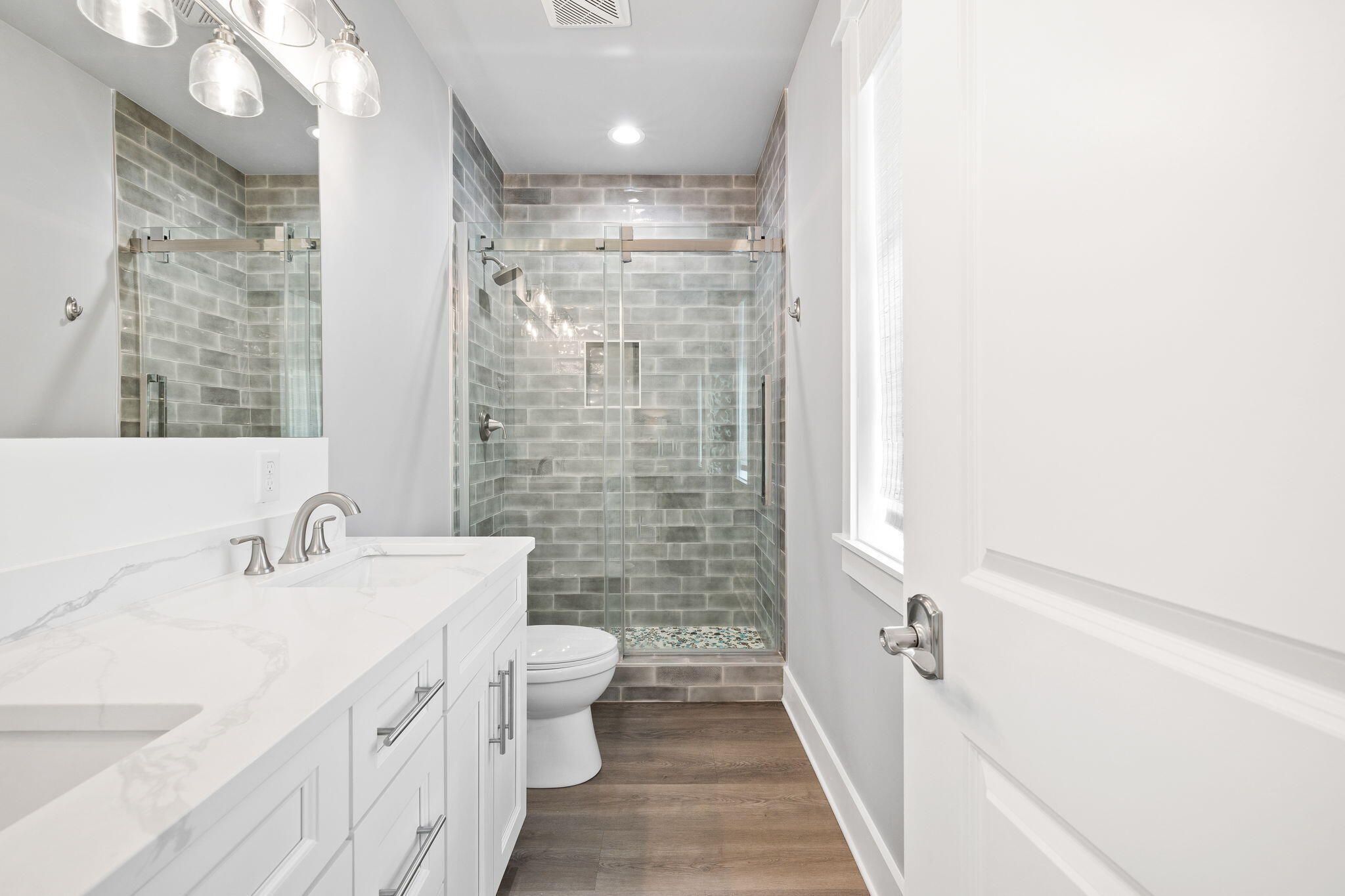 135 Redbud Ln Inlet Beach Inlet Beach, FL 32461 - Photo 25 of 66 a bathroom with a double vanity sink toilet and shower