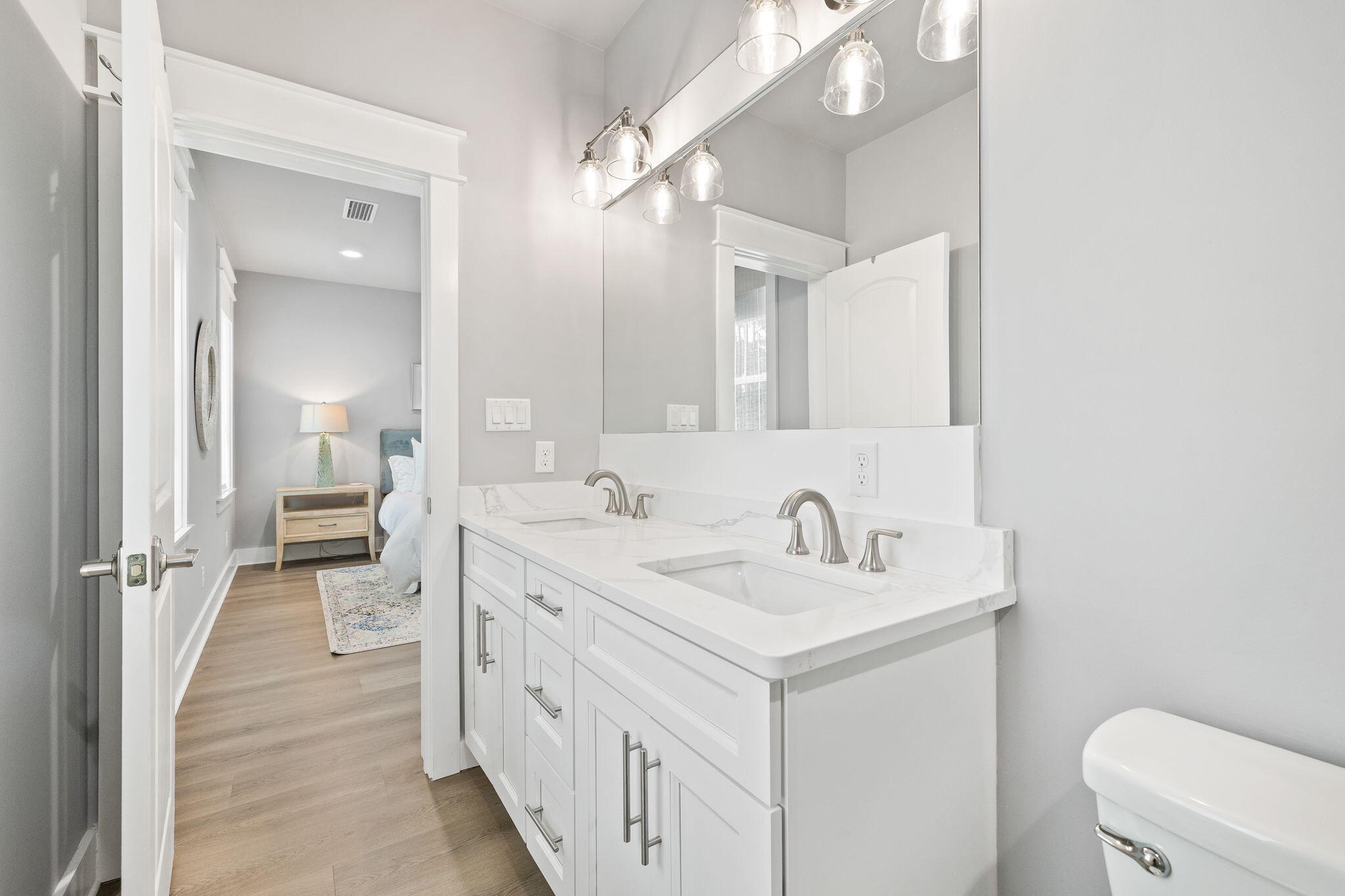 135 Redbud Ln Inlet Beach Inlet Beach, FL 32461 - Photo 27 of 66 a spacious bathroom with a double vanity sink toilet and a mirror