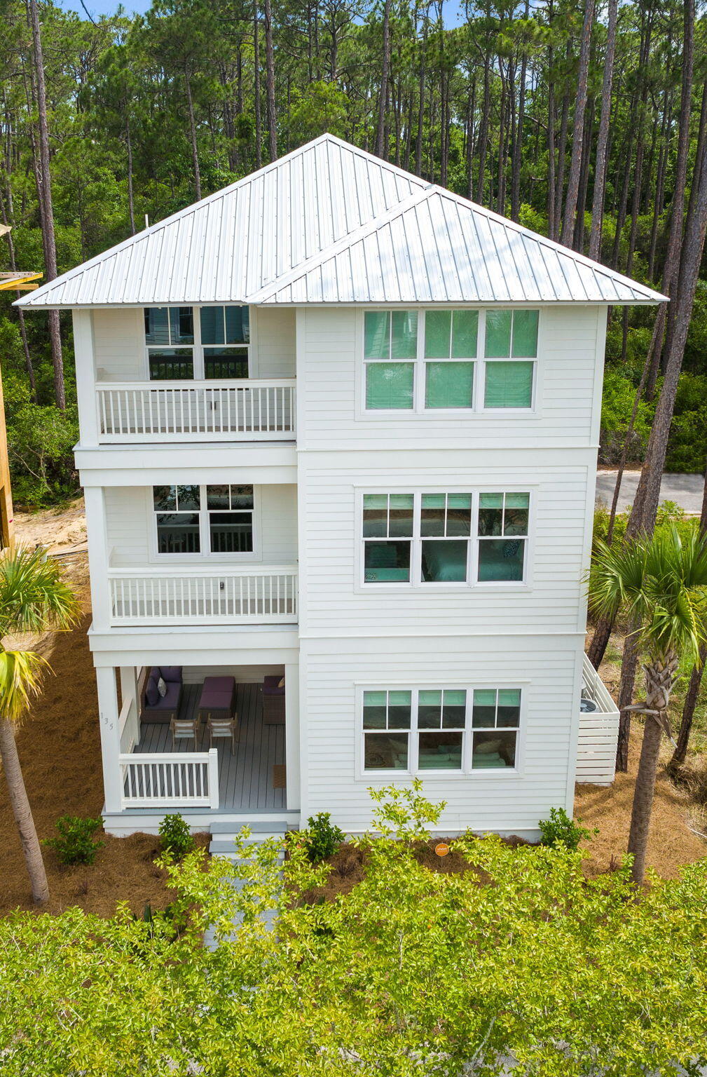 135 Redbud Ln Inlet Beach Inlet Beach, FL 32461 - Photo 4 of 66 a front view of a house with a yard