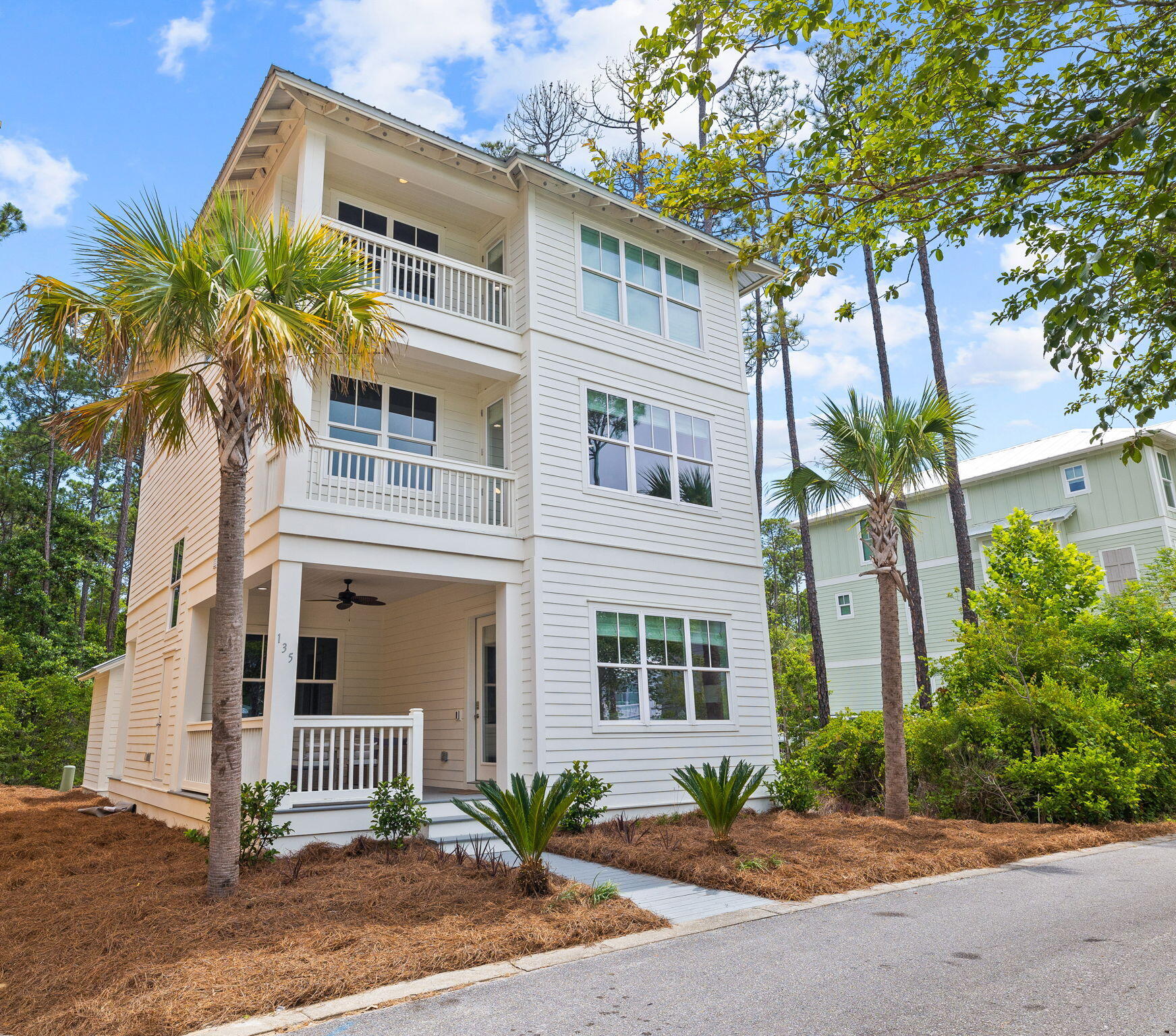 135 Redbud Ln Inlet Beach Inlet Beach, FL 32461 - Photo 5 of 66 a front view of a house with a yard and potted plants