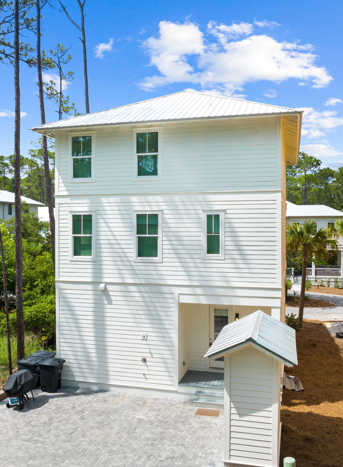 135 Redbud Ln Inlet Beach Inlet Beach, FL 32461 - Photo 6 of 66 a front view of a house with a yard