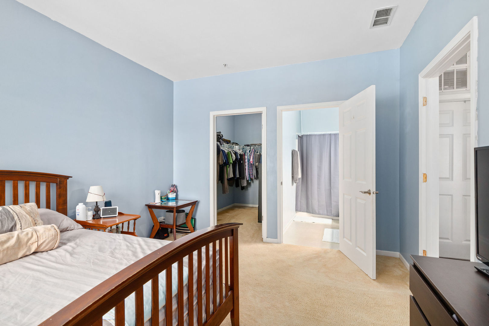 4486 Timber Ridge Court, Unit 4486 Joliet, IL 60431 - Photo 13 of 22 a view of a bedroom from a hallway