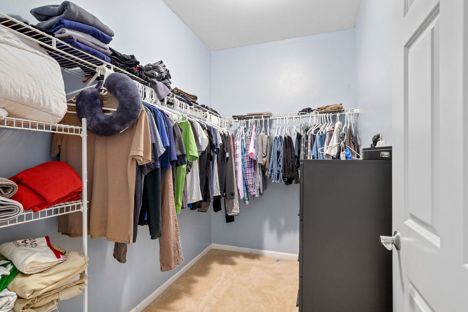 4486 Timber Ridge Court, Unit 4486 Joliet, IL 60431 - Photo 15 of 22 a view of walk in closet with clothes and shoes