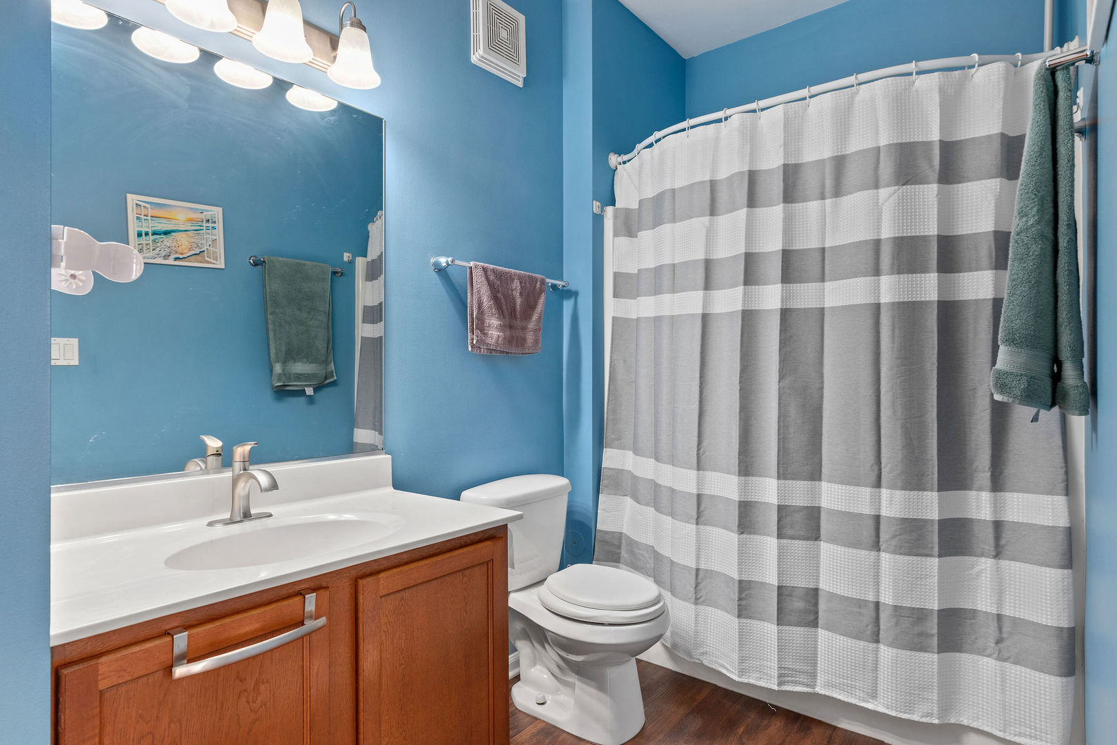 4486 Timber Ridge Court, Unit 4486 Joliet, IL 60431 - Photo 17 of 22 a bathroom with a sink toilet and shower