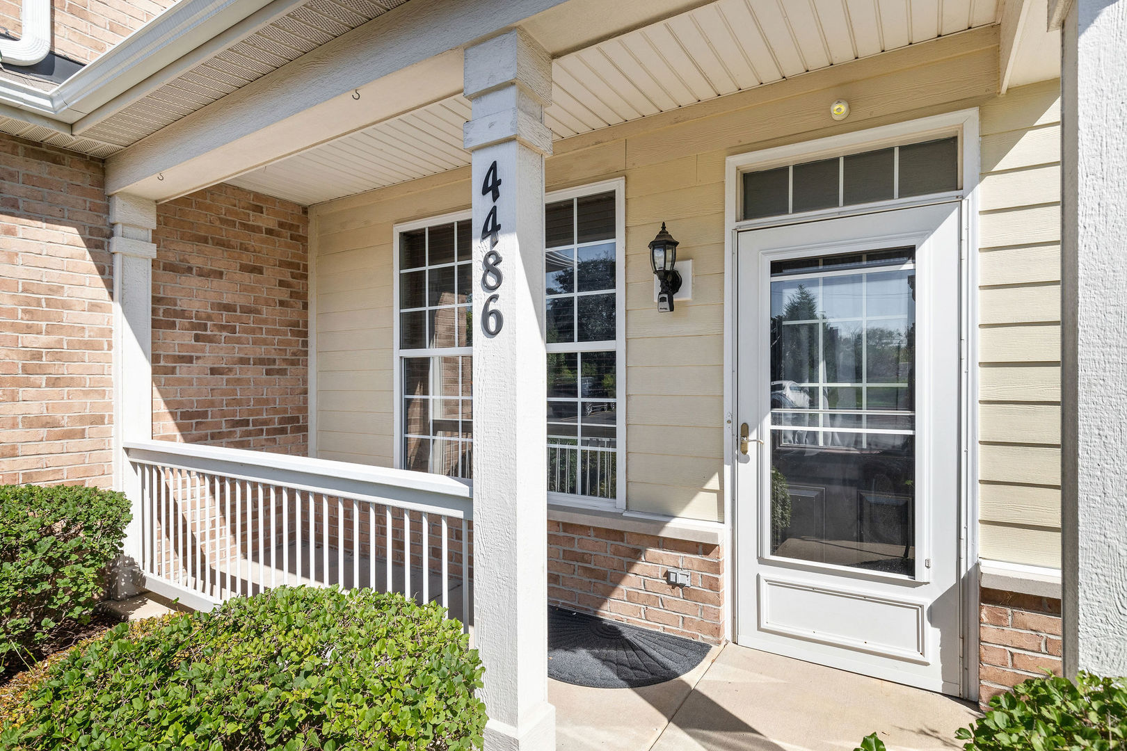 4486 Timber Ridge Court, Unit 4486 Joliet, IL 60431 - Photo 2 of 22 a view of a brick house with large windows