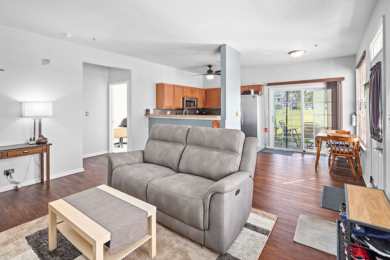 4486 Timber Ridge Court, Unit 4486 Joliet, IL 60431 - Photo 8 of 22 a living room with furniture and a wooden floor