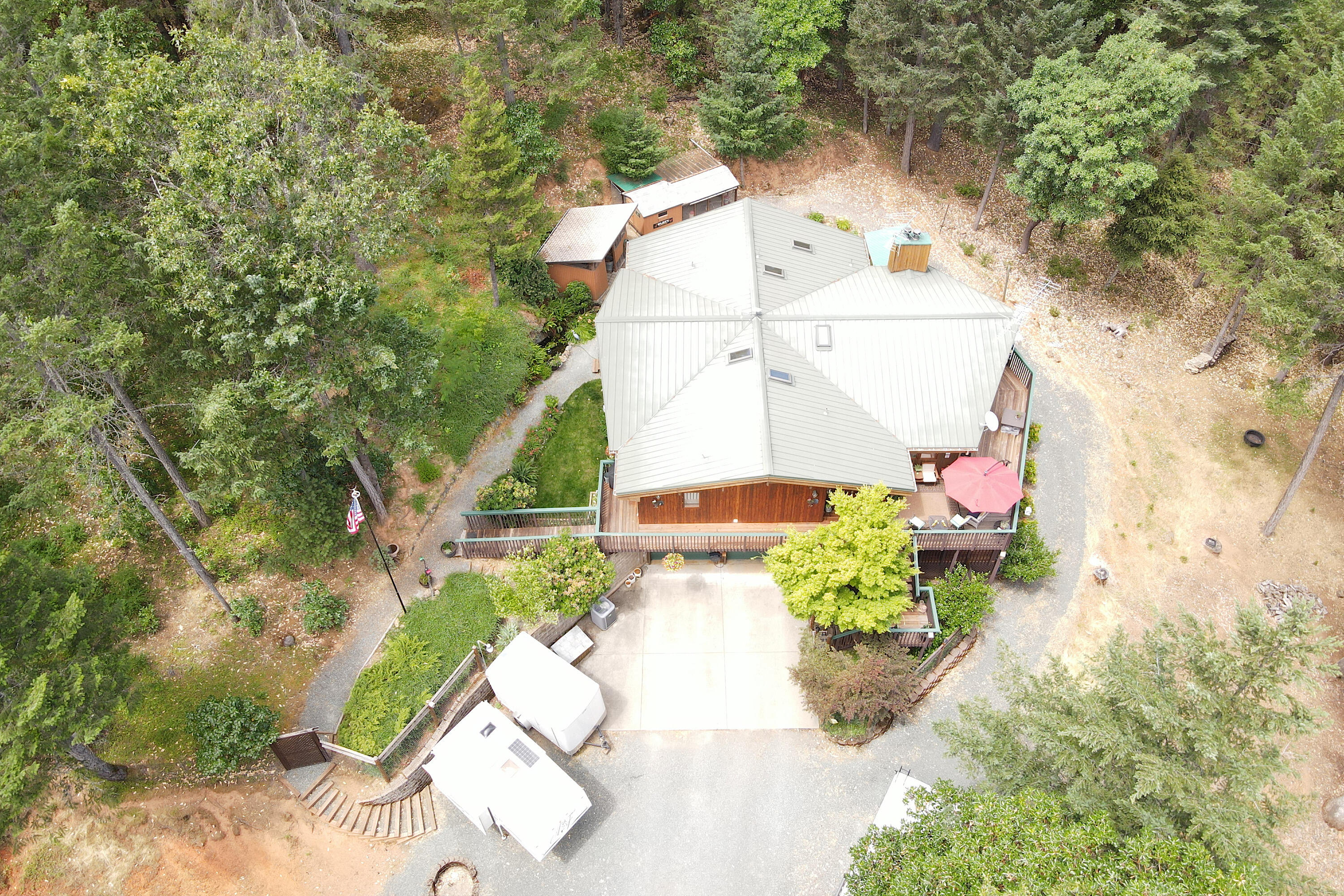 856 Greentree Loop Grants Pass, OR 97527 - Photo 4 of 62 an aerial view of a house with a yard and a large tree