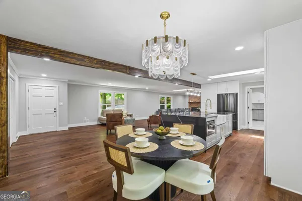 a view of a dining room with furniture window and wooden floor