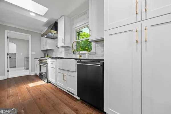 a kitchen with a sink and cabinets