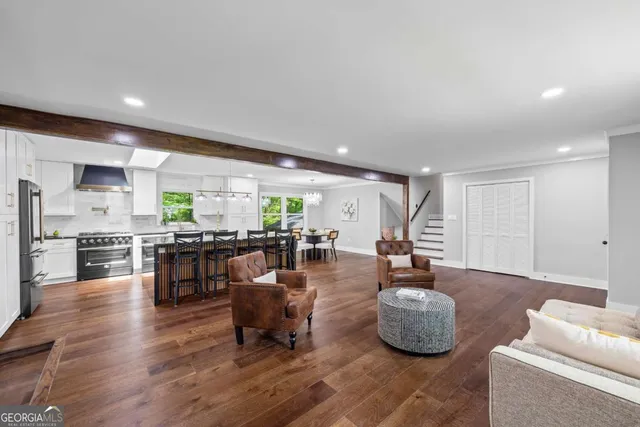 a bathroom with a granite countertop sink a toilet and shower