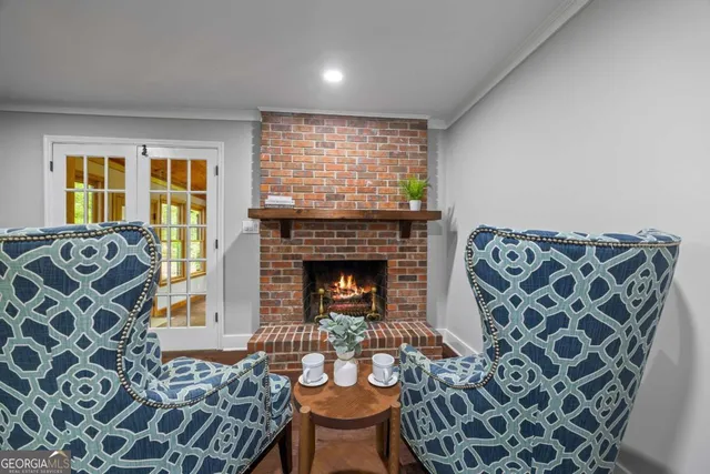 a view of a house with a yard and sitting area