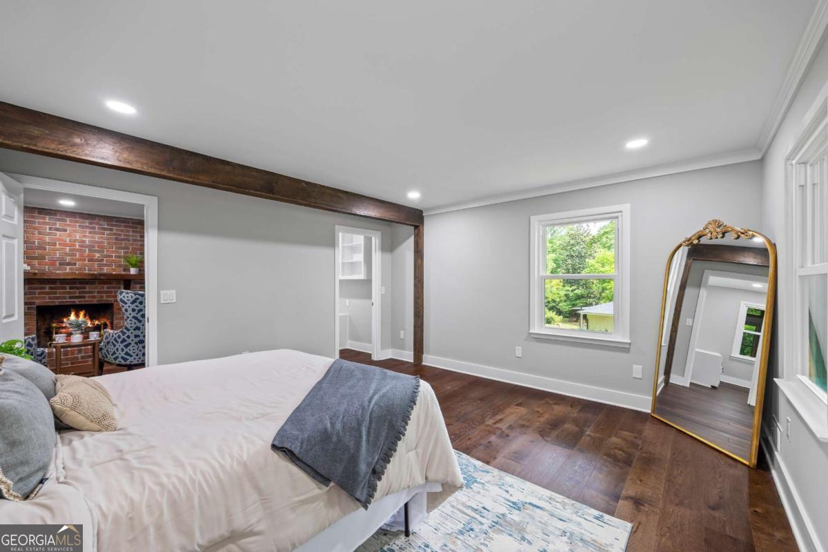 125 Terrell Drive Athens, GA 30606 - Photo 53 of 75 a view of a bedroom with a large bed and a window