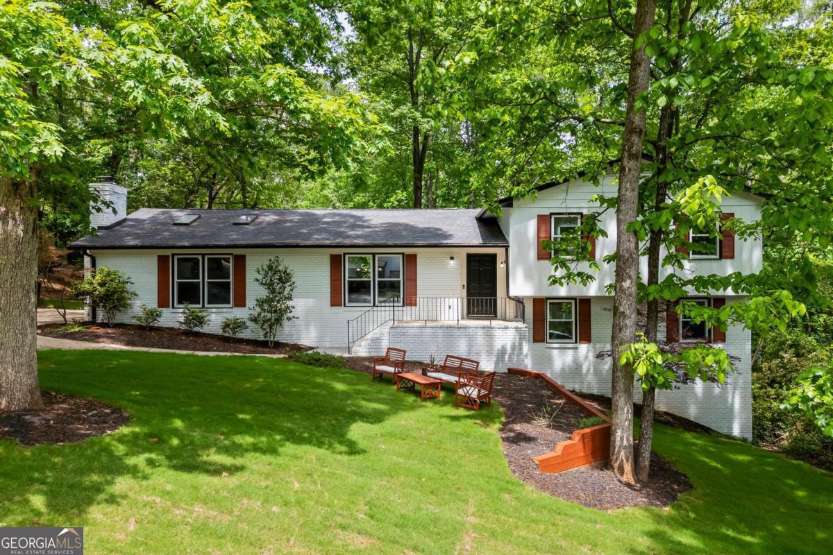 125 Terrell Drive Athens, GA 30606 - Photo 66 of 75 a front view of a house with a yard table and chairs