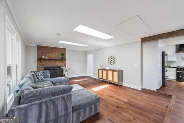 a view of a dining room with furniture wooden floor and chandelier
