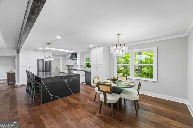 a view of living room with furniture and wooden floor