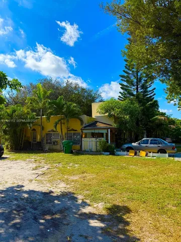 a view of a swimming pool with an outdoor space and seating area