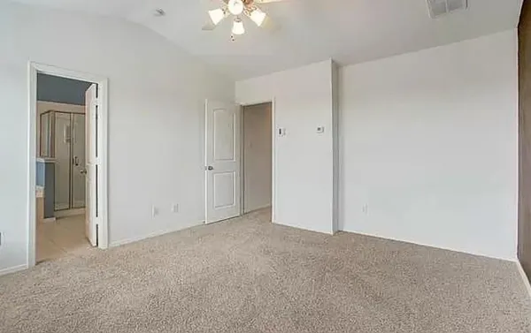 an empty room with a bathroom