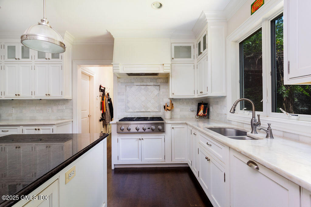 3 Elizabeth Lane Riverside, CT 06878 - Photo 11 of 39 a kitchen with stainless steel appliances granite countertop a sink stove and cabinets