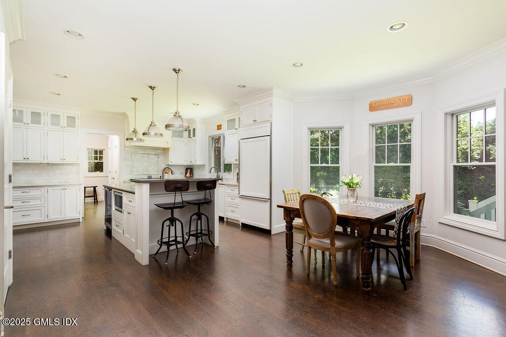 3 Elizabeth Lane Riverside, CT 06878 - Photo 12 of 39 a view of a dining room with furniture and wooden floor