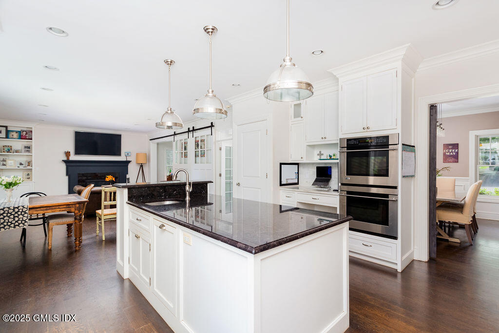 3 Elizabeth Lane Riverside, CT 06878 - Photo 14 of 39 a kitchen with stainless steel appliances granite countertop a sink dishwasher a stove and a refrigerator with wooden floor