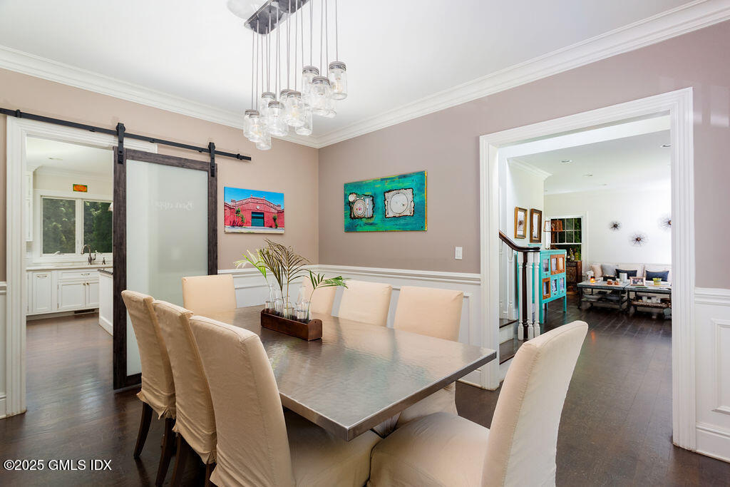 3 Elizabeth Lane Riverside, CT 06878 - Photo 15 of 39 a view of a dining room with furniture and a chandelier
