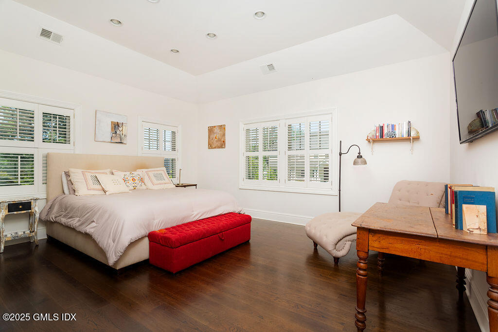 3 Elizabeth Lane Riverside, CT 06878 - Photo 18 of 39 a bedroom with a bed and a window