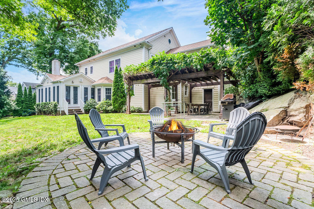 3 Elizabeth Lane Riverside, CT 06878 - Photo 2 of 39 a view of a house with backyard porch and sitting area