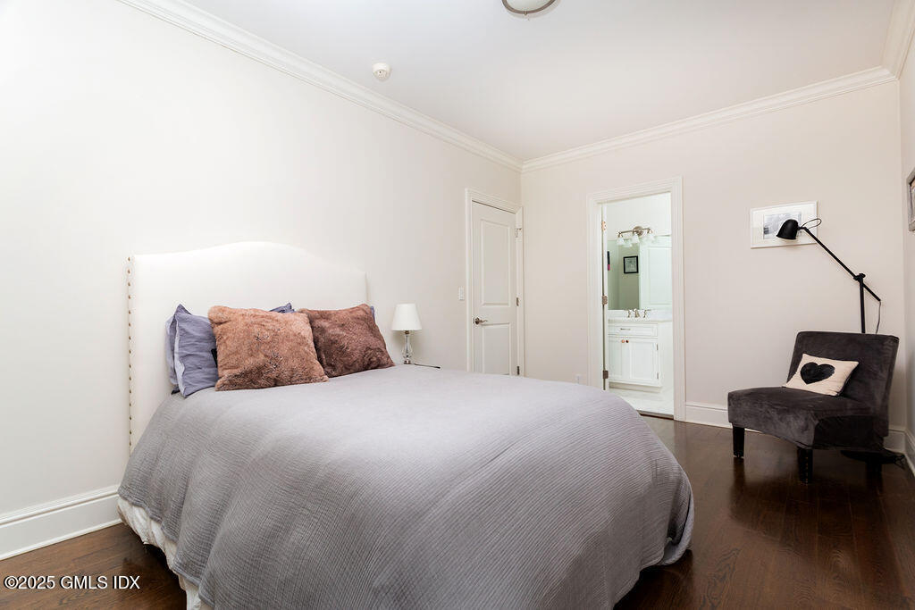 3 Elizabeth Lane Riverside, CT 06878 - Photo 21 of 39 a bedroom with a bed and a chair