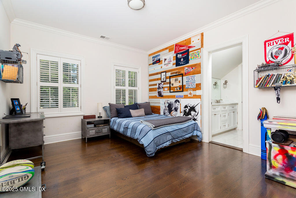 3 Elizabeth Lane Riverside, CT 06878 - Photo 23 of 39 a bedroom with furniture and a flat screen tv