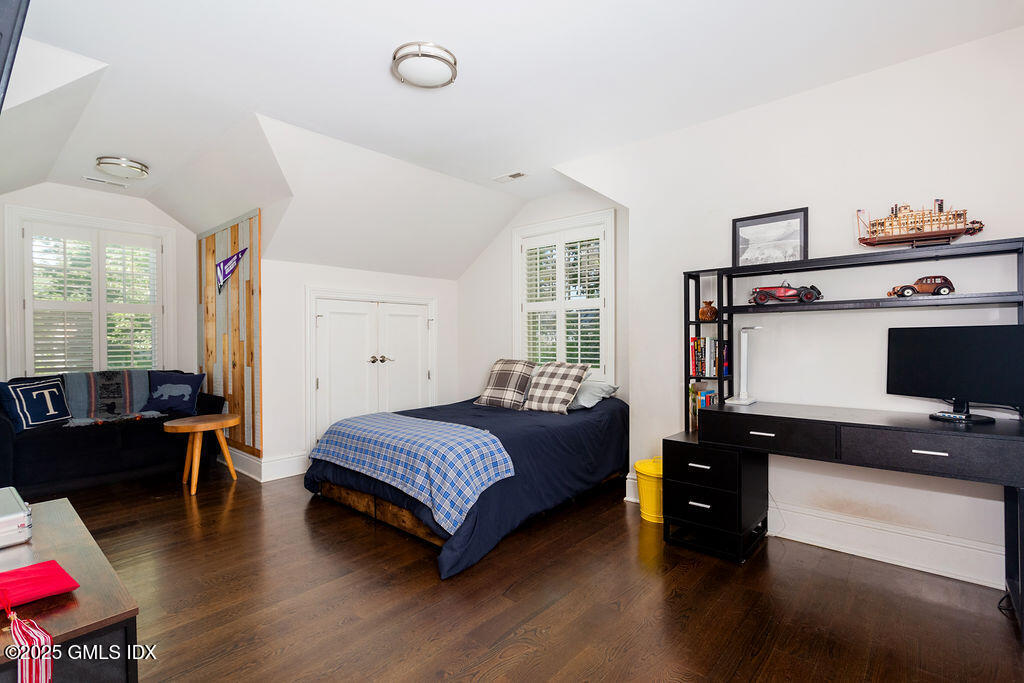 3 Elizabeth Lane Riverside, CT 06878 - Photo 25 of 39 a bedroom with a bed and wooden floor