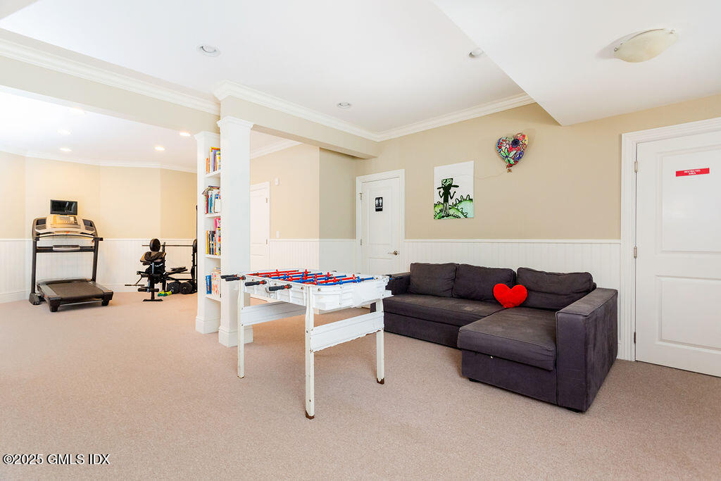 3 Elizabeth Lane Riverside, CT 06878 - Photo 28 of 39 a living room with furniture and a table