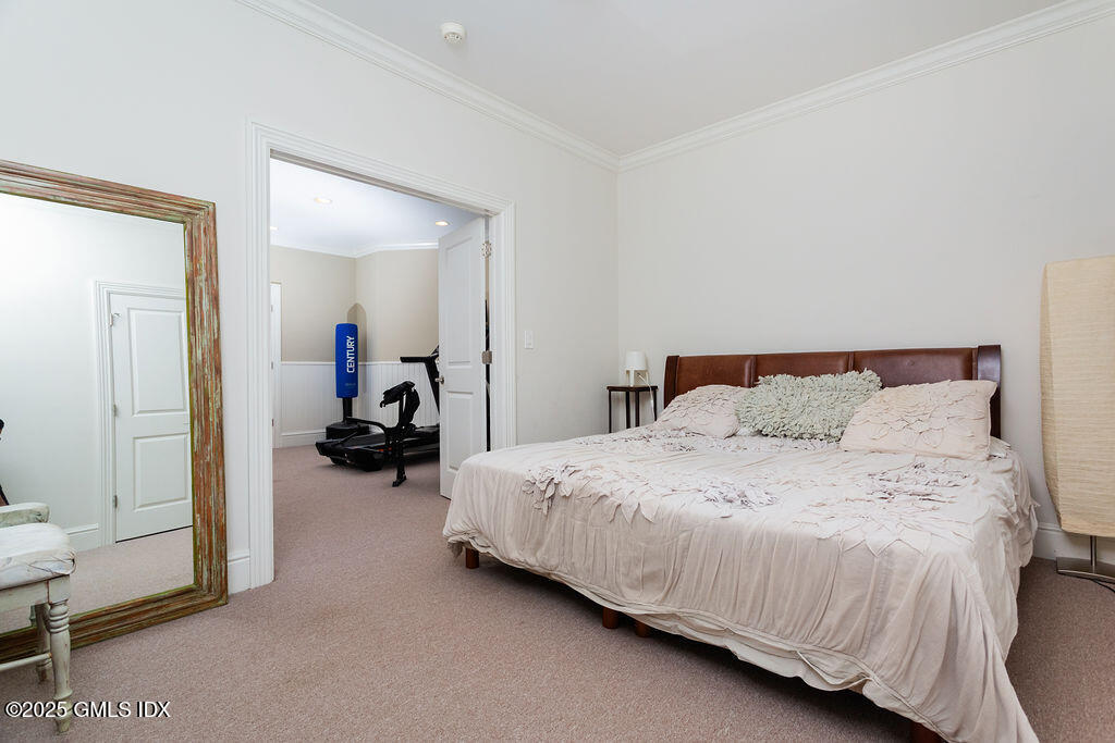 3 Elizabeth Lane Riverside, CT 06878 - Photo 30 of 39 a bed room with a bed and a car