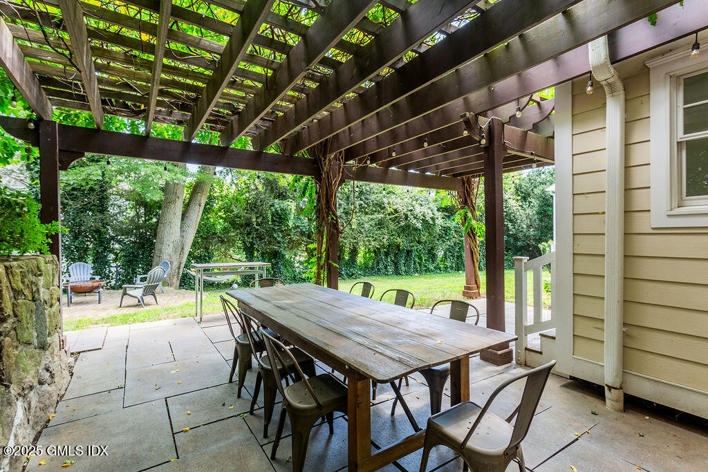3 Elizabeth Lane Riverside, CT 06878 - Photo 33 of 39 a view of a patio with a table chairs and a backyard