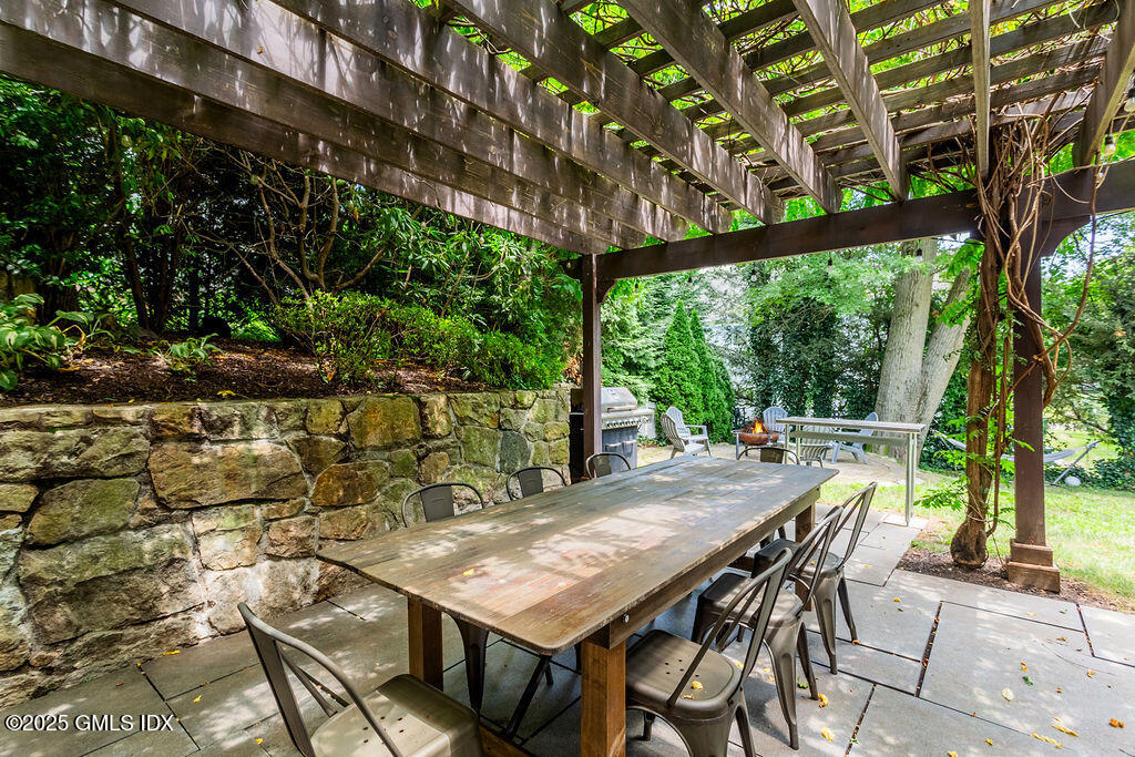 3 Elizabeth Lane Riverside, CT 06878 - Photo 34 of 39 a view of an outdoor space with a table and chairs