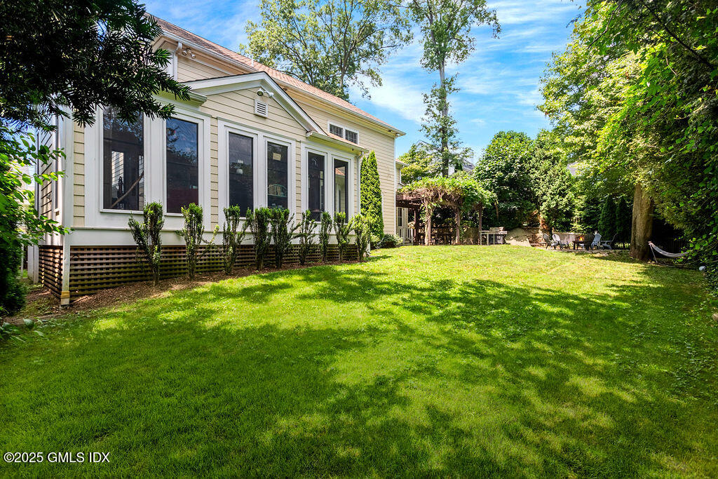 3 Elizabeth Lane Riverside, CT 06878 - Photo 35 of 39 a view of a house with a yard