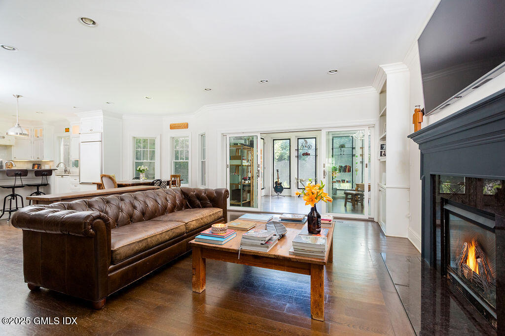 3 Elizabeth Lane Riverside, CT 06878 - Photo 8 of 39 a living room with furniture and a fireplace